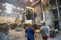 Berlin, Germany - April 18, 2013: Production of metal components in a foundry - group of workers Royalty Free Stock Photo