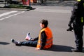 Berlin, Germany - April 24, 2023: Protesters from the group Last Generation sitting on the street and blocking traffic