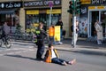 Berlin, Germany - April 24, 2023: Protesters from the group Last Generation sitting on the street and blocking traffic