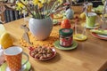 View to a colorful easygoing family breakfast table decorated for Easter