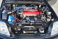 Berlin, Germany - August 20, 2022: Detail car view of engine bay enhanced Honda DOHC VTEC engine selective focus shot. Royalty Free Stock Photo