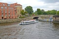 BERLIN, GERMANY. The excursion ship floats down the river Spree under the Monbizhu bridge