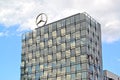 BERLIN, GERMANY. A fragment of a facade of the building of Europa Center with an emblem of the Mercedes-Benz company