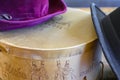 A historic hatbox from Berlin in the 19th century with two old hats on an old wooden table