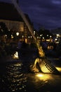 Lighted statue in form of a crocodile in the historic Neptune`s Fountain in the center of Berlin at night Royalty Free Stock Photo