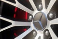 Berlin, Germany - August 20, 2022: Mercedes-Benz AMG alloy wheel plug and rims selective focus closeup. German luxury
