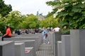 BERLIN, GERMANY. Tourists among the plates of the Holocaust Memorial Complex Royalty Free Stock Photo