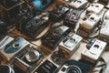 Berlin, Germany - August 14, 2022: Vintage cameras at the flea market. Old and used digital and film cameras for hipster