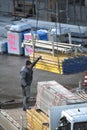 Berlin Germany 02.15.2024, a construction worker loading scaffolding Royalty Free Stock Photo