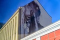 Berlin, Germany - December 02, 2016: Graffiti on the wall of an old house. An elderly man is looking closing one eye. French Royalty Free Stock Photo