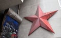 Part of the Berlin wall and red star near Checkpoint Charlie between east and west sectors