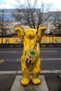 Berlin, Germany - December 02, 2016: Sculpture of a large yellow bear in the street of Berlin