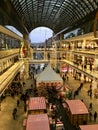 Shopping `Mall of Berlin` decorated for Christmas, busy with many Shoppers and illuminated with thousands of lights Royalty Free Stock Photo