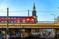 Berlin, Germany - December 02, 2016: View of Berlin with the tower of the Marienkirche. The red color train of the underground