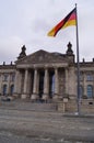 Berlin, Germany: facade of the Reichstag building, the German Parliament, and flag Royalty Free Stock Photo