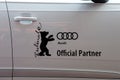 Bear, Berlinale symbol, and Audi logo on a car