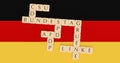 Germany Politics Concept: Letter Tiles Bundestag And The Names of All Parties In It On German Flag, 3d illustration