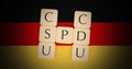 Germany Politics Grand Coalition Concept: Letter Tiles CDU, CSU And SPD On German Flag, 3d illustration