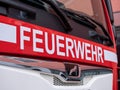 Berlin, Germany - February 09, 2020: The white letters Feuerwehr, the german firefighter logo, on red MAN truck