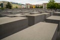 14.05.2019. Berlin, Germany. Holocaust monument. View in the field from concrete slabs of the different size and height. City sigh