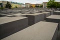 14.05.2019. Berlin, Germany. Holocaust monument. View in the field from concrete slabs of the different size and height. City sigh