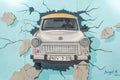 Berlin, Germany: 14 Jan 2019 - Trabant breaking throught the wall painting on Berlin Wall in East Side Gallery Royalty Free Stock Photo