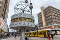 Berlin, Germany: 16 Jan 2019 - The Word Clock situated in Alexanderplatz with buildings and a yellow tram in the background