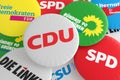 Pile of Buttons With The Logo of The Political Parties CDU, CSU, SPD, FDP, AfD, The Left And The Greens, 3d illustration