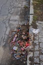 Various remains of a New Year`s Eve celebration on the sidewalk of a street