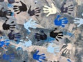 Detail of Berlin wall with painted hands on it Royalty Free Stock Photo