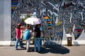 Group of tourists on sightseeing tour at the Berlin Wall / East Royalty Free Stock Photo