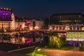 Night shot of a harbor on the Teltow Canal in Berlin-Tempelhof with boats, old warehouses and cranes. There are also restaurants w Royalty Free Stock Photo