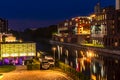 Night shot of a harbor on the Teltow Canal in Berlin-Tempelhof with old warehouses. There are also restaurants with colorful light