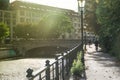 BERLIN, GERMANY - July 28, 2018: Peaceful morning light over an antique bridge, old-style buildings, and the tree-filled