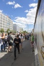 People inspect the surviving fragment of the Berlin Wall