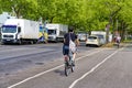 Street scene with cyclist in Berlin. The cycle path was painted to give cyclists more space in traffic