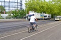Street scene with cyclist in Berlin. The cycle path was painted to give cyclists more space in traffic