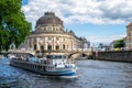 Berlin / Germany - 1 July 2018: Tourist boat passing in front of Bode Museum, located on Museum Island, on Spree river Royalty Free Stock Photo