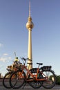 Berlin / Germany - 1 July 2018: Two dockless rental bikes from Donkey Republic bike sharing company in front of the TV Tower