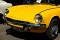 Front of a yellow Triumph car at Oldtimer automobile and vintage