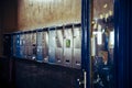 Metal mailboxes in the entrance hallway of an old apartment building