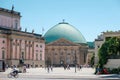 People at historic district Bebelplatz of Berlin in font of the State Opera building and St. Hedwig`s Cathedral Royalty Free Stock Photo