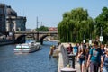 People at riverside in park on a sunny summer day at Monbijoupa Royalty Free Stock Photo