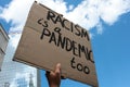 Racism is a pandemic too sign at Berlin silent demo following the death of George Floyd by police violence