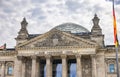 Berlin, Germany - June 29, 2022: The Reichstag Building, seat of the german parliament, the Bundestag. The german flag on a Royalty Free Stock Photo