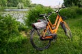 Berlin / Germany - 29 June 2018: Two Donkey Republic rented bicycles parked near a lake in the interior gardens of Charlottenburg