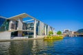 BERLIN, GERMANY - JUNE 06, 2015: Yellow boat arrives to a modern construction on the river in Berlin, Marie Elisabeth