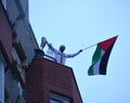 Berlin Germany 02.12.2023, a man on a balcony with a Palestinian flag