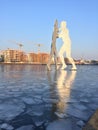 Iced river Spree with the popular landmark Molecule Man in Berlin Royalty Free Stock Photo