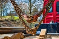 Massive and rusty chains and hooks on the load area of a truck